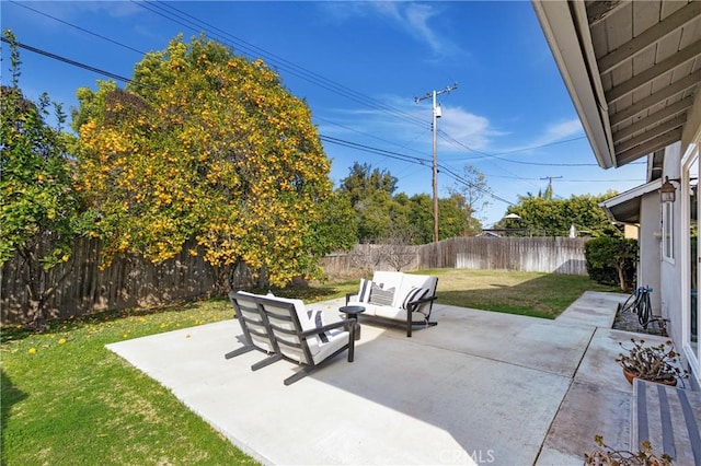 view of patio featuring a fenced backyard and an outdoor living space