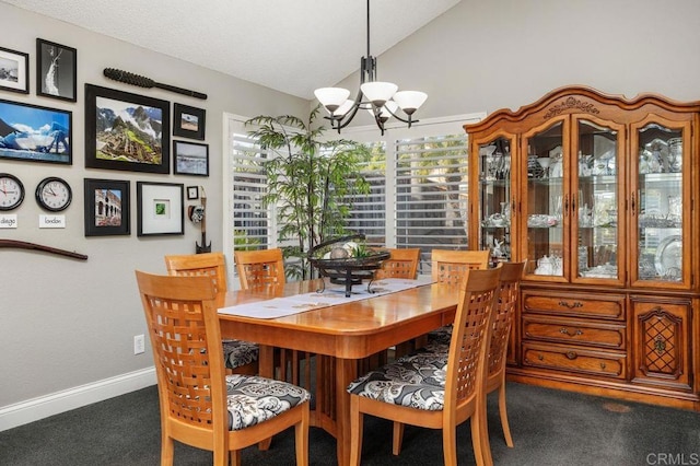 dining area with lofted ceiling, dark carpet, baseboards, and a notable chandelier