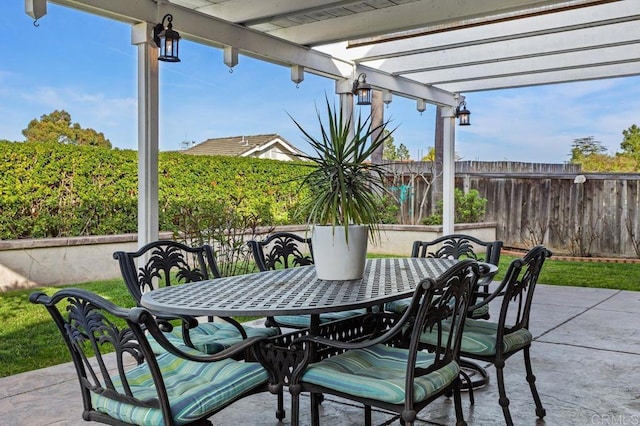 view of patio / terrace featuring a fenced backyard, a pergola, and outdoor dining space