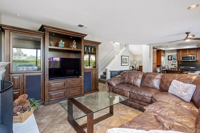 living room with visible vents, ceiling fan, stairs, light tile patterned flooring, and recessed lighting