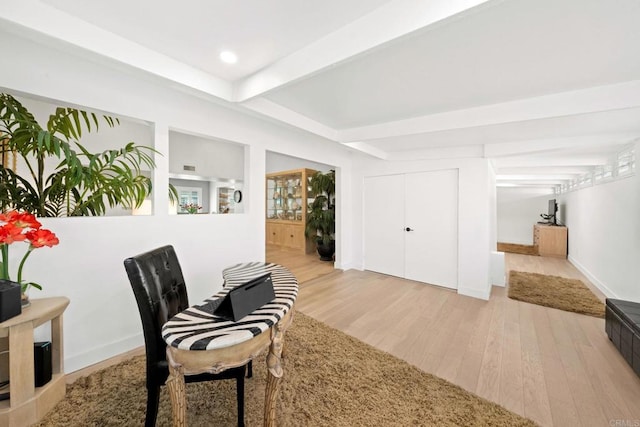 sitting room with light wood-style flooring, baseboards, beam ceiling, and recessed lighting