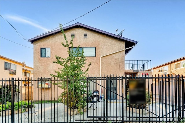 view of gate with fence