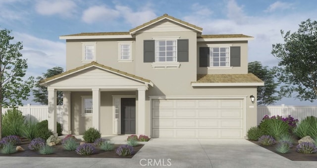 traditional home featuring fence, driveway, an attached garage, and stucco siding