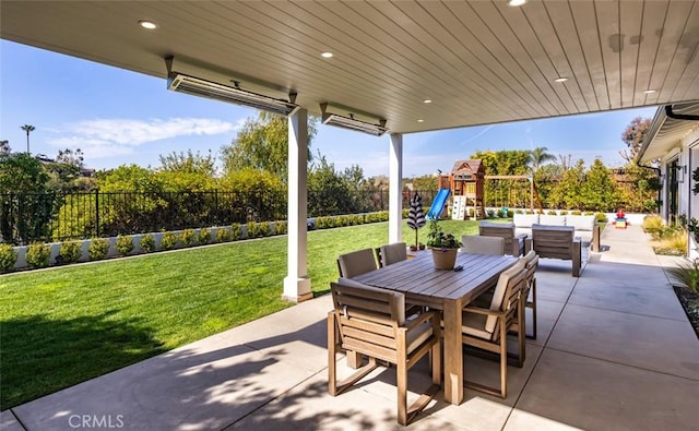 view of patio / terrace featuring outdoor dining space, a playground, fence, and outdoor lounge area