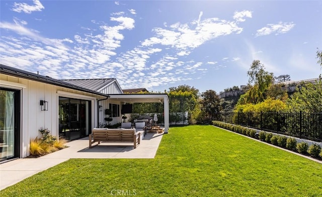 view of yard with a fenced backyard, a patio, and an outdoor hangout area