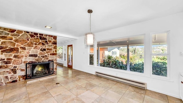 unfurnished living room featuring a baseboard radiator, a stone fireplace, and baseboards