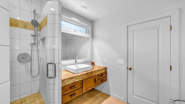 full bathroom featuring a shower stall and vanity