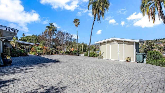 exterior space featuring decorative driveway