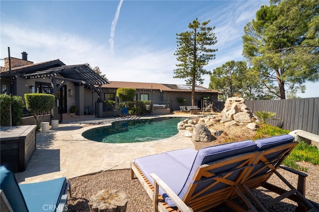 view of pool with a fenced in pool, a patio area, and fence