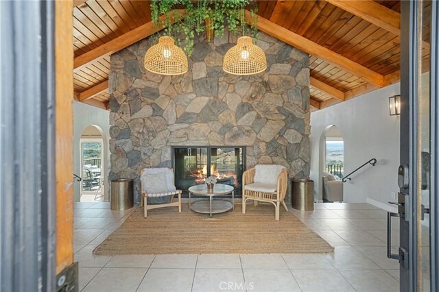 sitting room with tile patterned floors and arched walkways