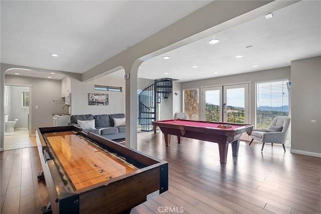 rec room with baseboards, recessed lighting, wood finished floors, arched walkways, and billiards