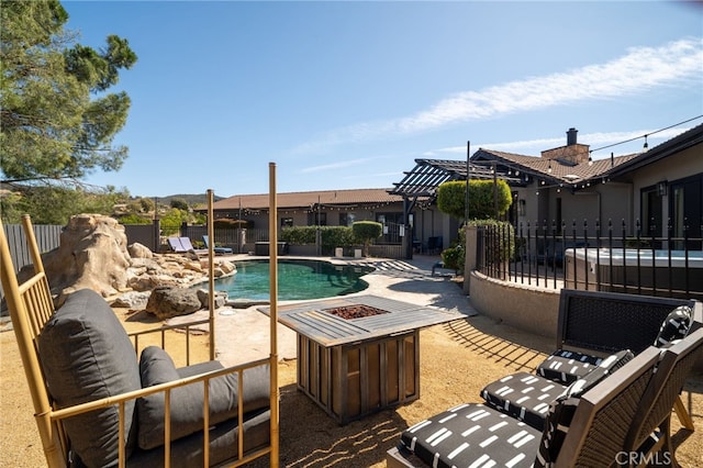 view of pool with a fenced in pool, a patio, a fire pit, and a fenced backyard