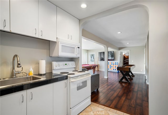 38270 Calaveras Rd, Temecula, CA 92592 - kitchen with white appliances, a sink, white cabinetry, billiards table, and arched walkways