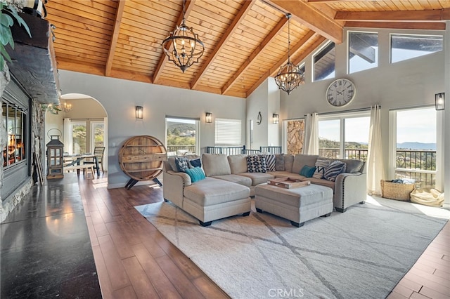 38270 Calaveras Rd, Temecula, CA 92592 - living area with a chandelier, wooden ceiling with exposed beams, high vaulted ceiling, hardwood / wood-style floors, and arched walkways