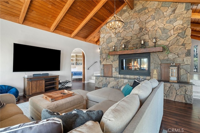 38270 Calaveras Rd, Temecula, CA 92592 - living room featuring arched walkways, wood ceiling with exposed beams, baseboards, a chandelier, and wood finished floors