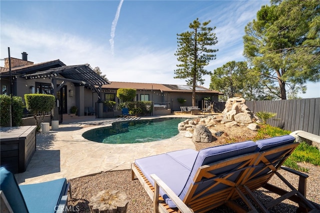 view of pool with a fenced in pool, fence, and a patio area