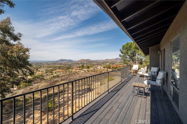 balcony featuring a mountain view