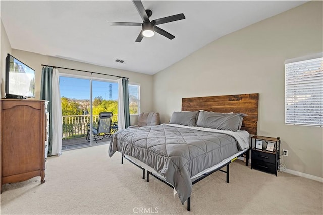 bedroom with lofted ceiling, light carpet, visible vents, baseboards, and access to exterior