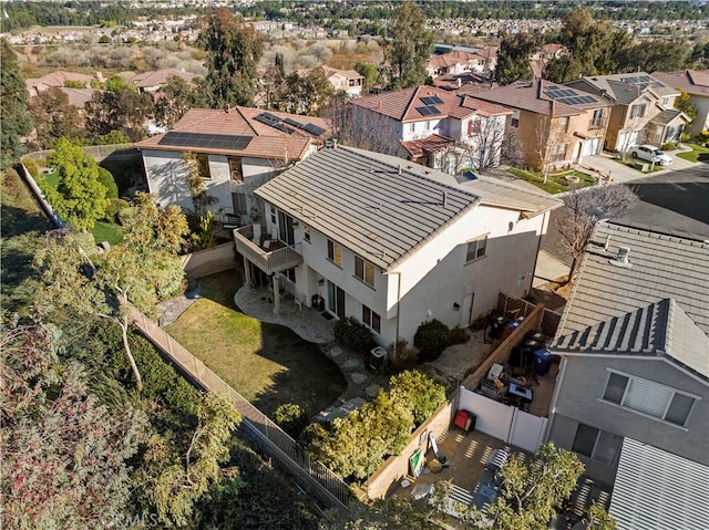 birds eye view of property with a residential view