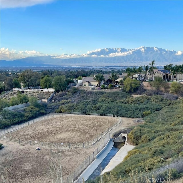 birds eye view of property featuring a mountain view