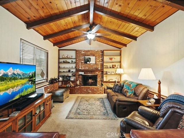 carpeted living room featuring vaulted ceiling with beams, a fireplace, wood ceiling, and a ceiling fan