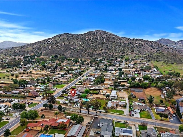 970 3rd St, Norco, CA 92860 - aerial overview of property's location with a mountainous background and nearby suburban area