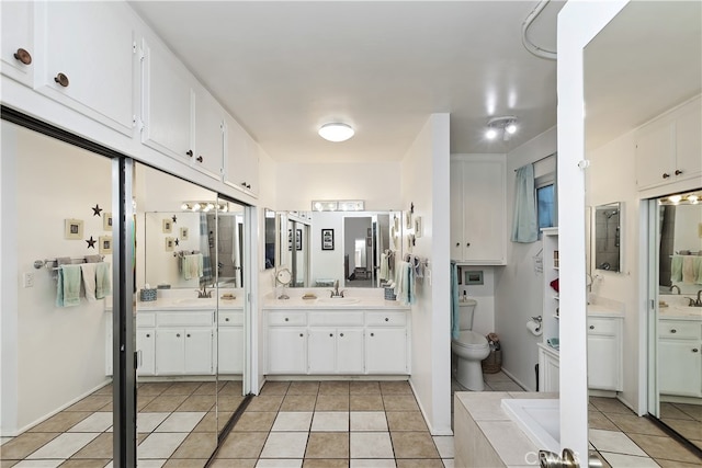 970 3rd St, Norco, CA 92860 - full bath featuring tile patterned flooring, two vanities, and toilet