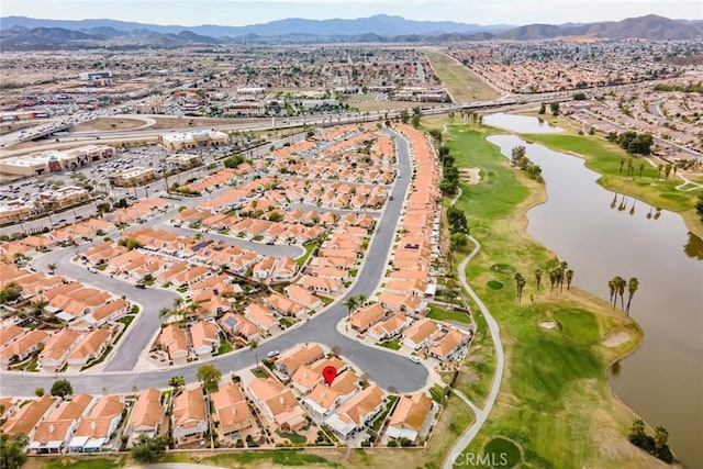 drone / aerial view with a residential view and a water and mountain view