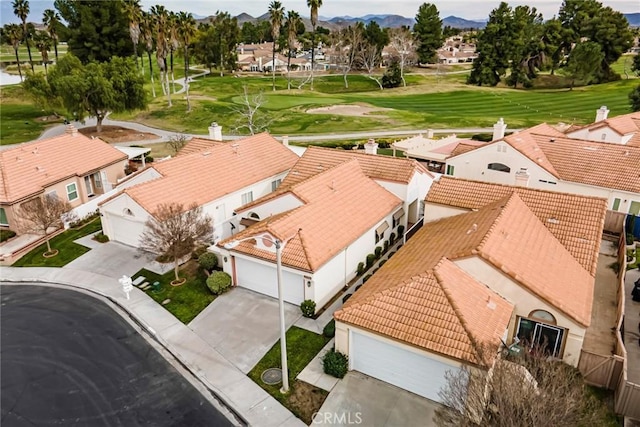 bird's eye view featuring a residential view, a mountain view, and golf course view