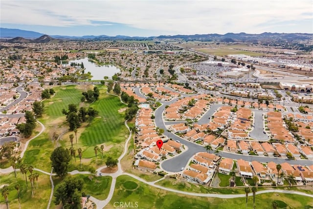 birds eye view of property with a residential view and a water and mountain view