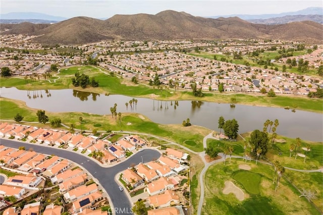 drone / aerial view with a residential view and a water and mountain view