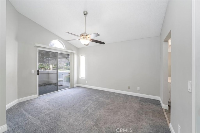 unfurnished bedroom featuring access to outside, carpet flooring, vaulted ceiling, and baseboards