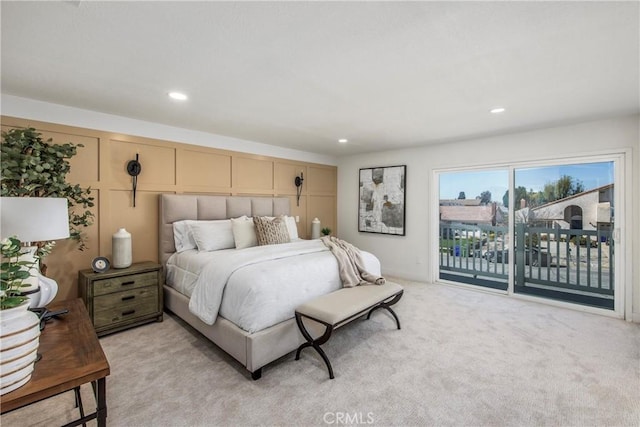 bedroom featuring light carpet, access to exterior, and recessed lighting