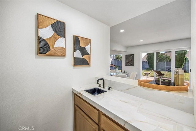 bathroom featuring vanity and recessed lighting