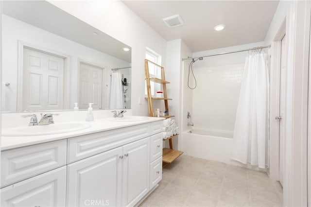 full bathroom with shower / tub combo, tile patterned floors, a sink, and double vanity