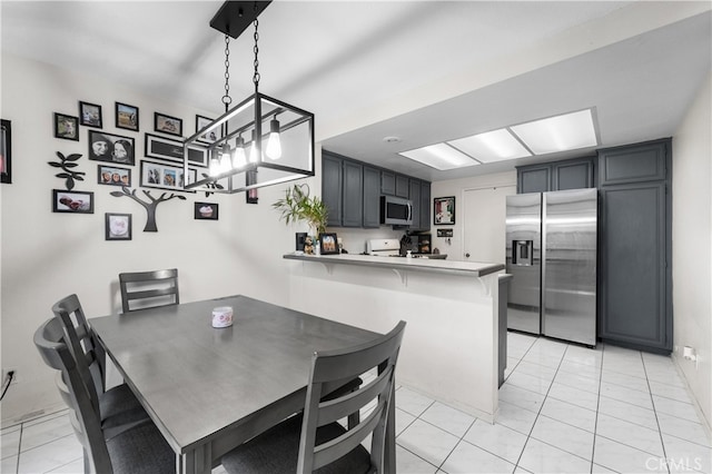 dining area featuring light tile patterned floors