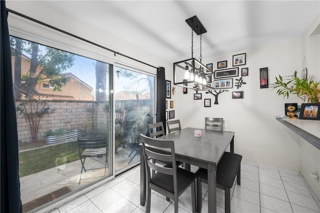 dining area with light tile patterned flooring