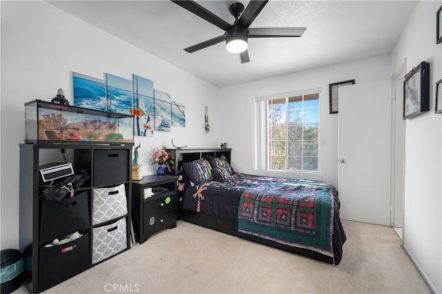 carpeted bedroom with a ceiling fan