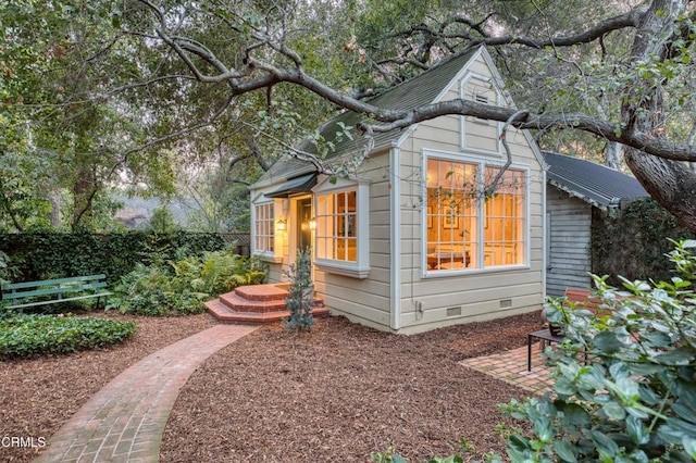 view of property exterior with crawl space and fence