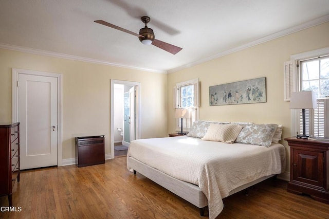 bedroom featuring ceiling fan, ornamental molding, wood finished floors, and baseboards