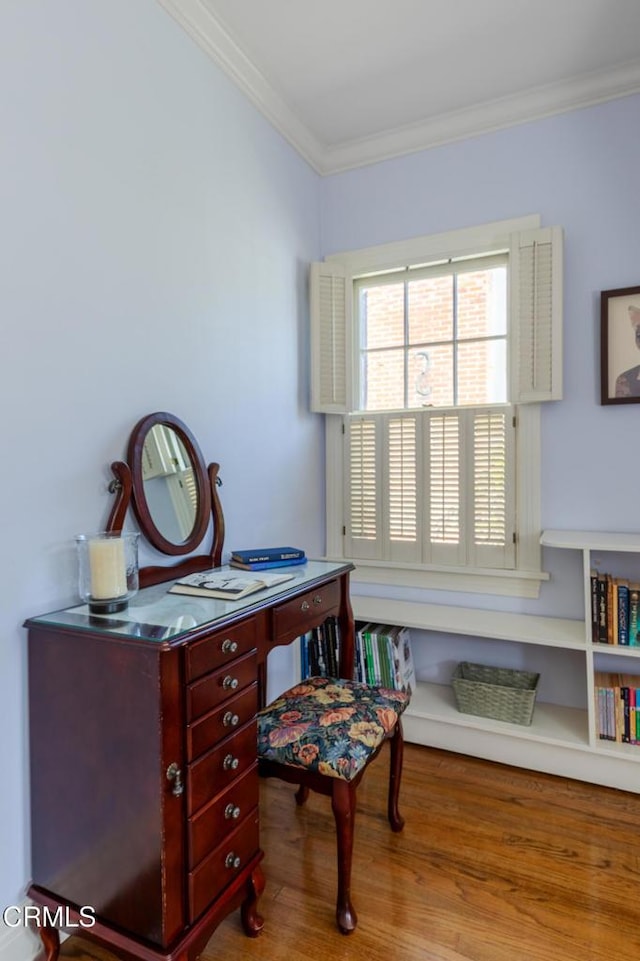 office featuring light wood-style floors and ornamental molding