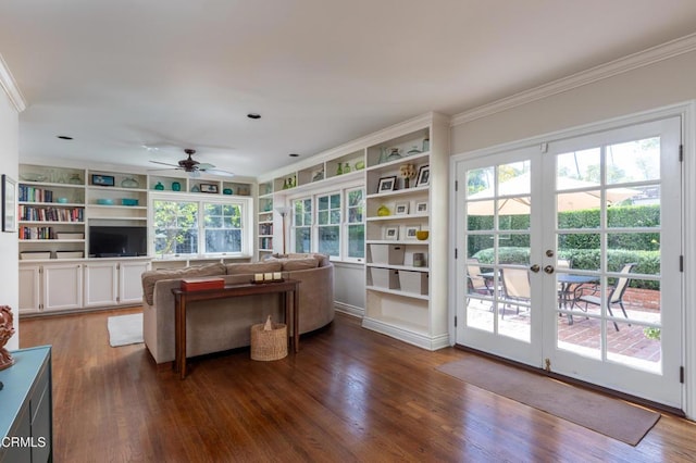 living room with dark wood-style floors, a ceiling fan, crown molding, and french doors