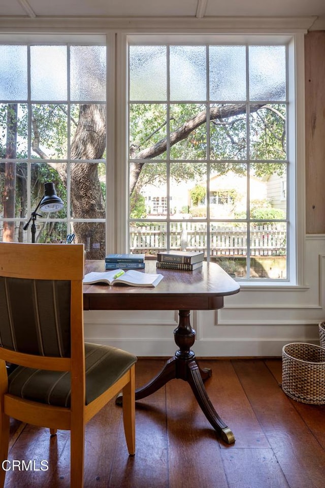 dining space with wood finished floors