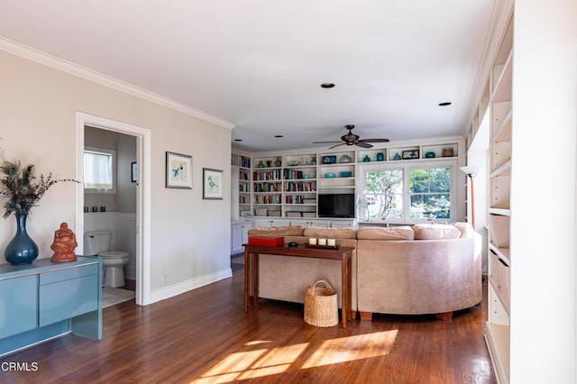 living room with a ceiling fan, crown molding, baseboards, and dark wood-style flooring