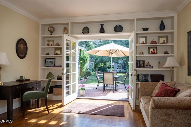 doorway to outside featuring french doors, wood finished floors, built in shelves, and crown molding