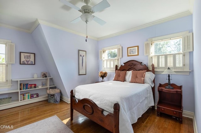 bedroom featuring dark wood-style floors, ceiling fan, baseboards, and crown molding