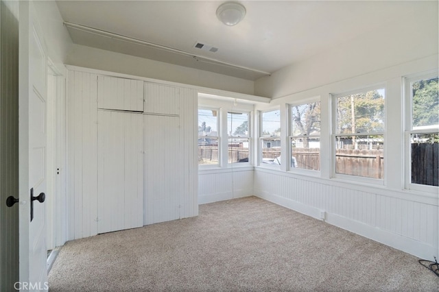 unfurnished sunroom with visible vents