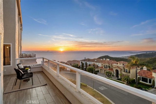 balcony at dusk with a water view