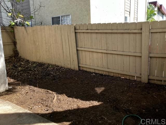 view of gate with fence