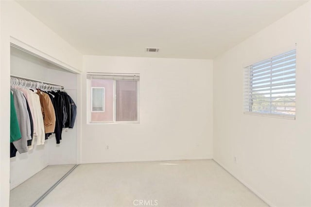 interior space featuring a closet and visible vents